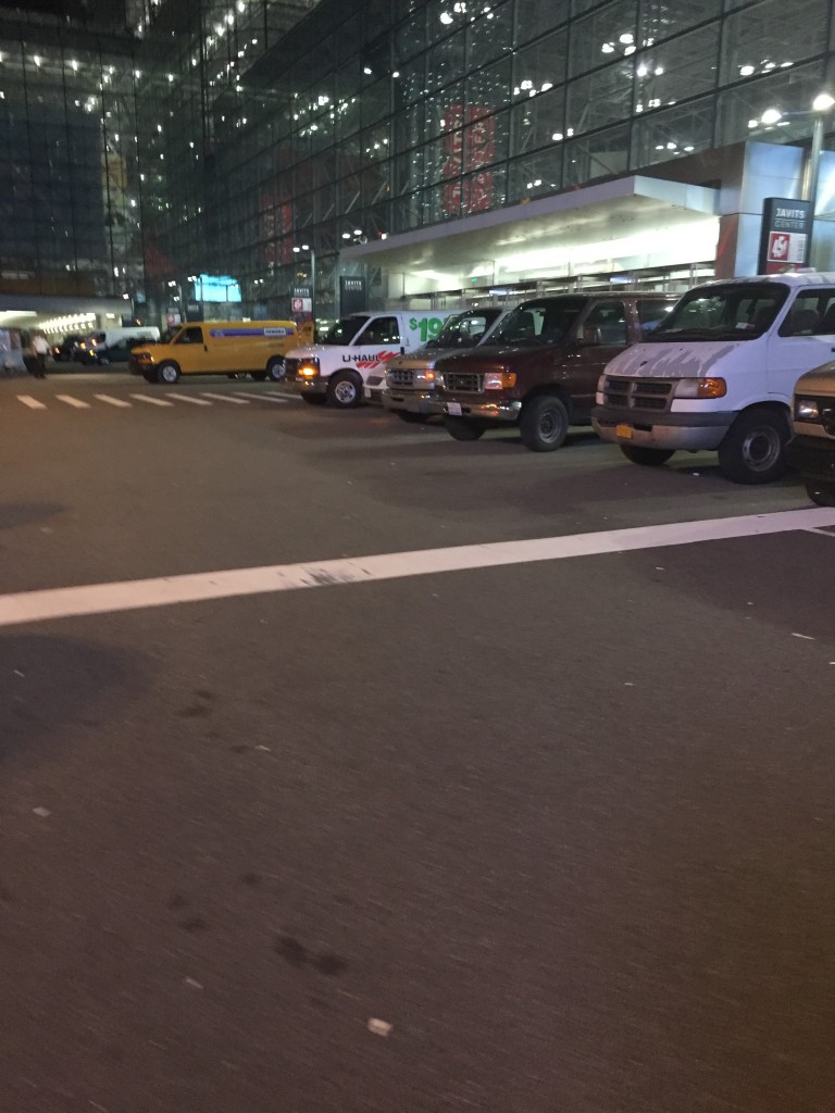 A line of trucks wait to be loaded up. Laura Cerrone 2015.